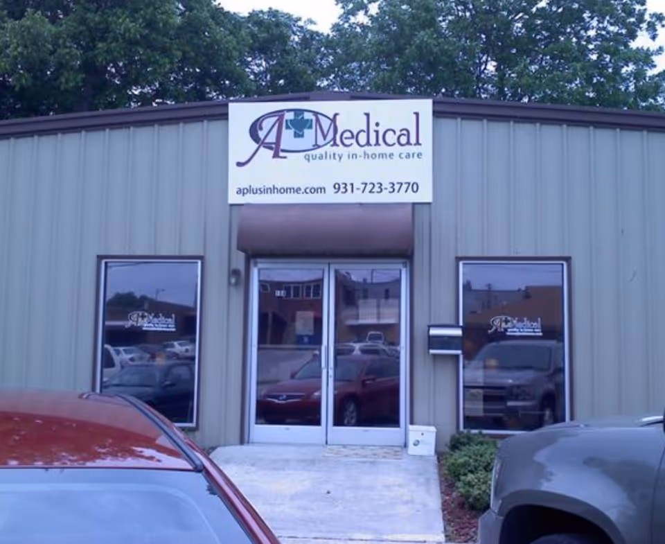 Front view of A Plus Medical Staffing office with sign and glass doors