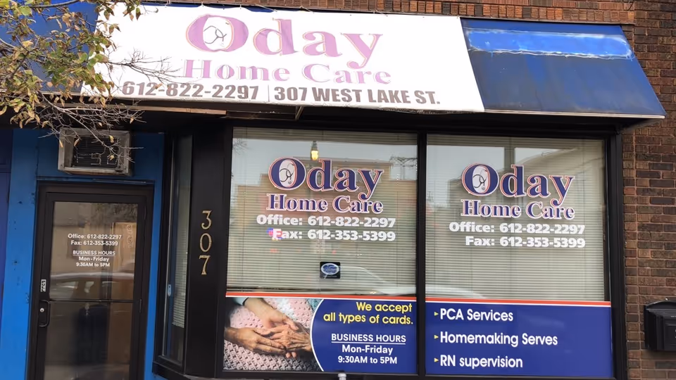 Exterior storefront with Oday Home Care signage and large window displays.