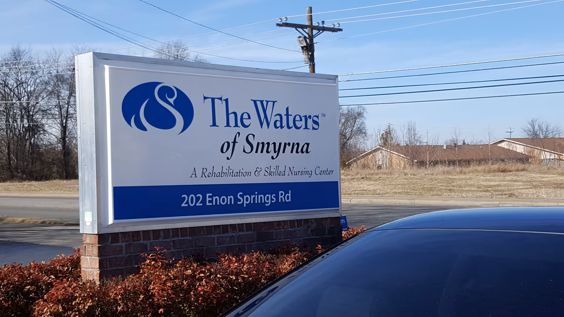 Outdoor sign for The Waters of Smyrna rehabilitation and skilled nursing center.