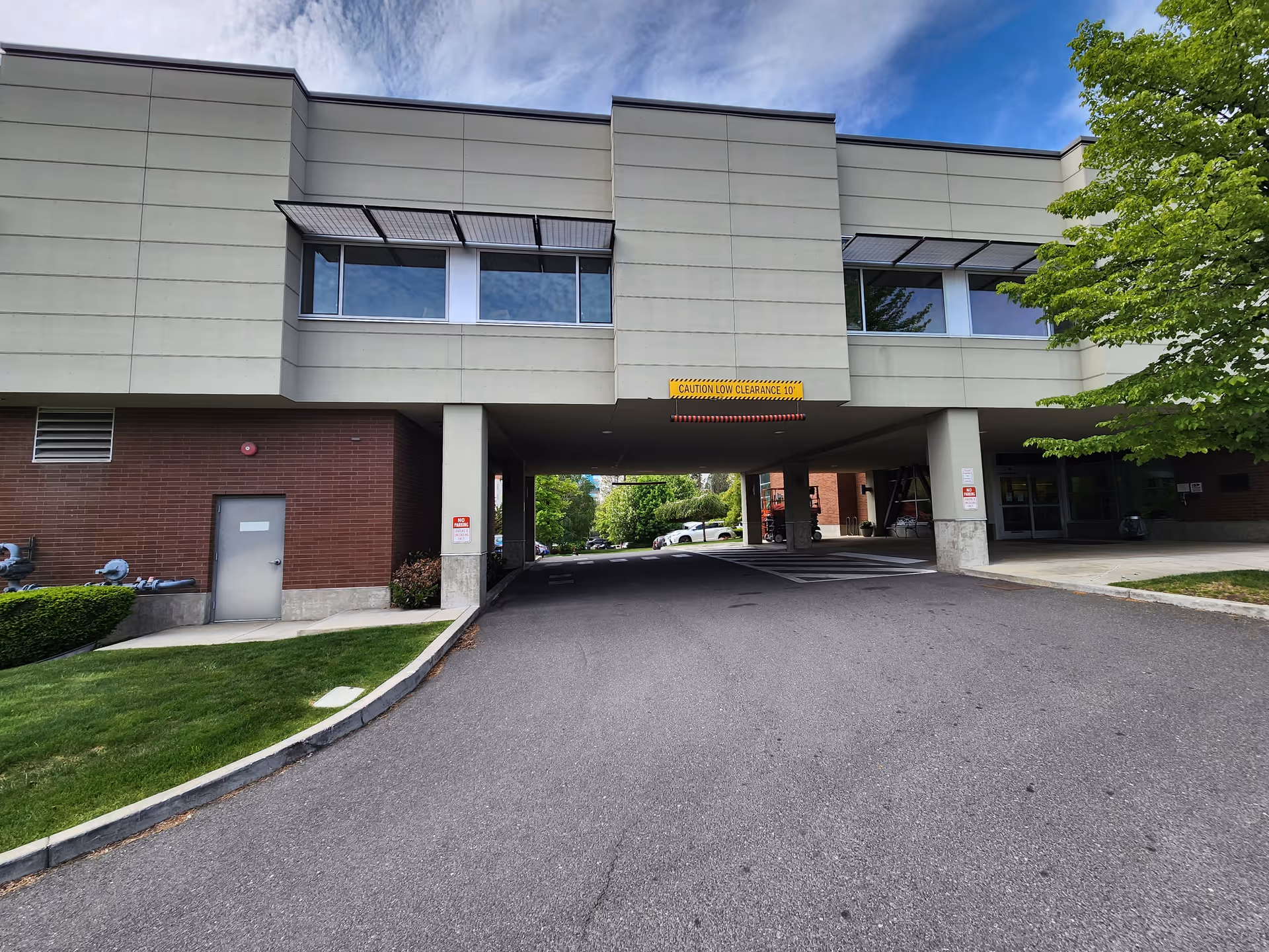 Exterior view of Providence St. Joseph Care Center with a covered entrance and driveway.