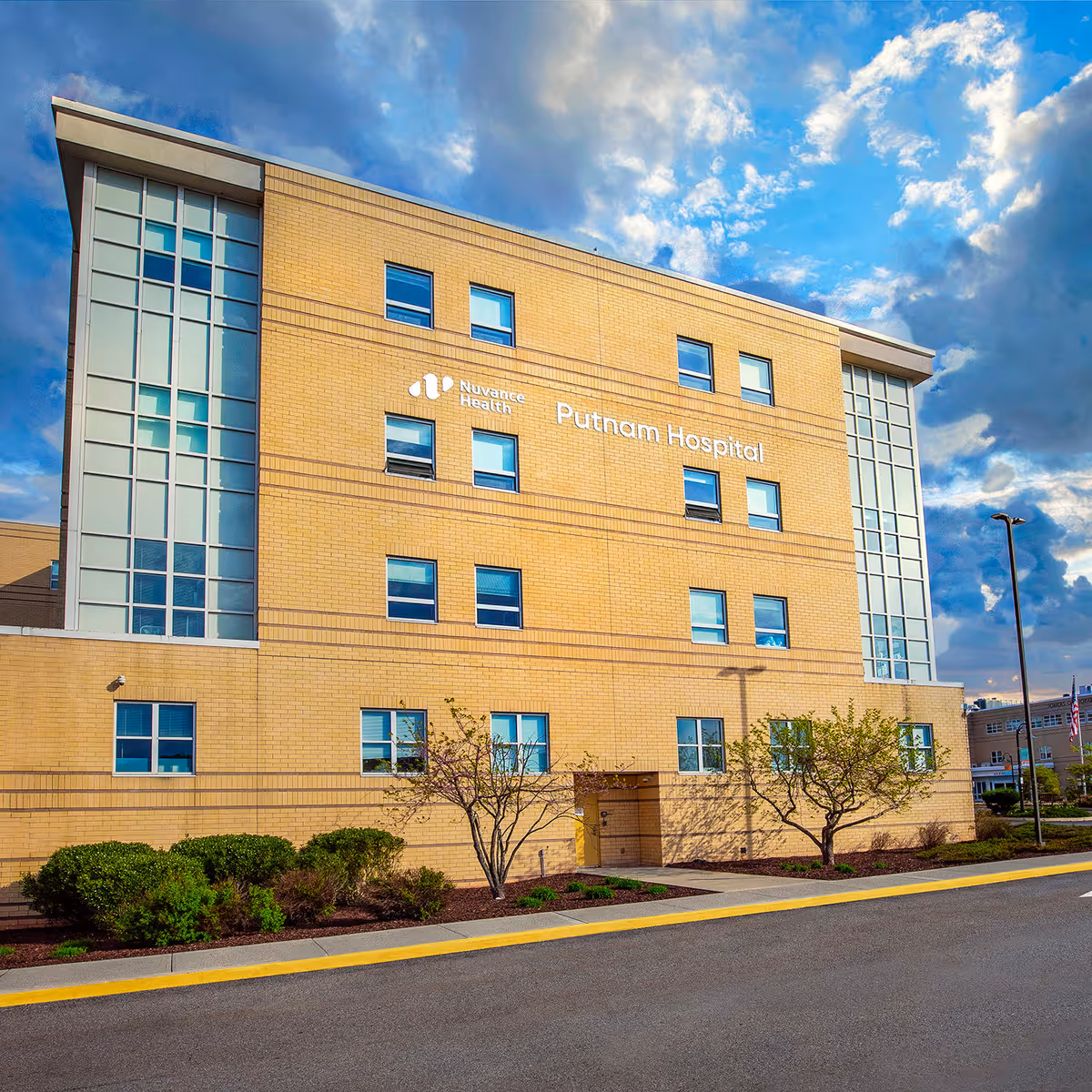 Exterior view of a brick hospital with Putnam Hospital signage and Nuvance Health logo.