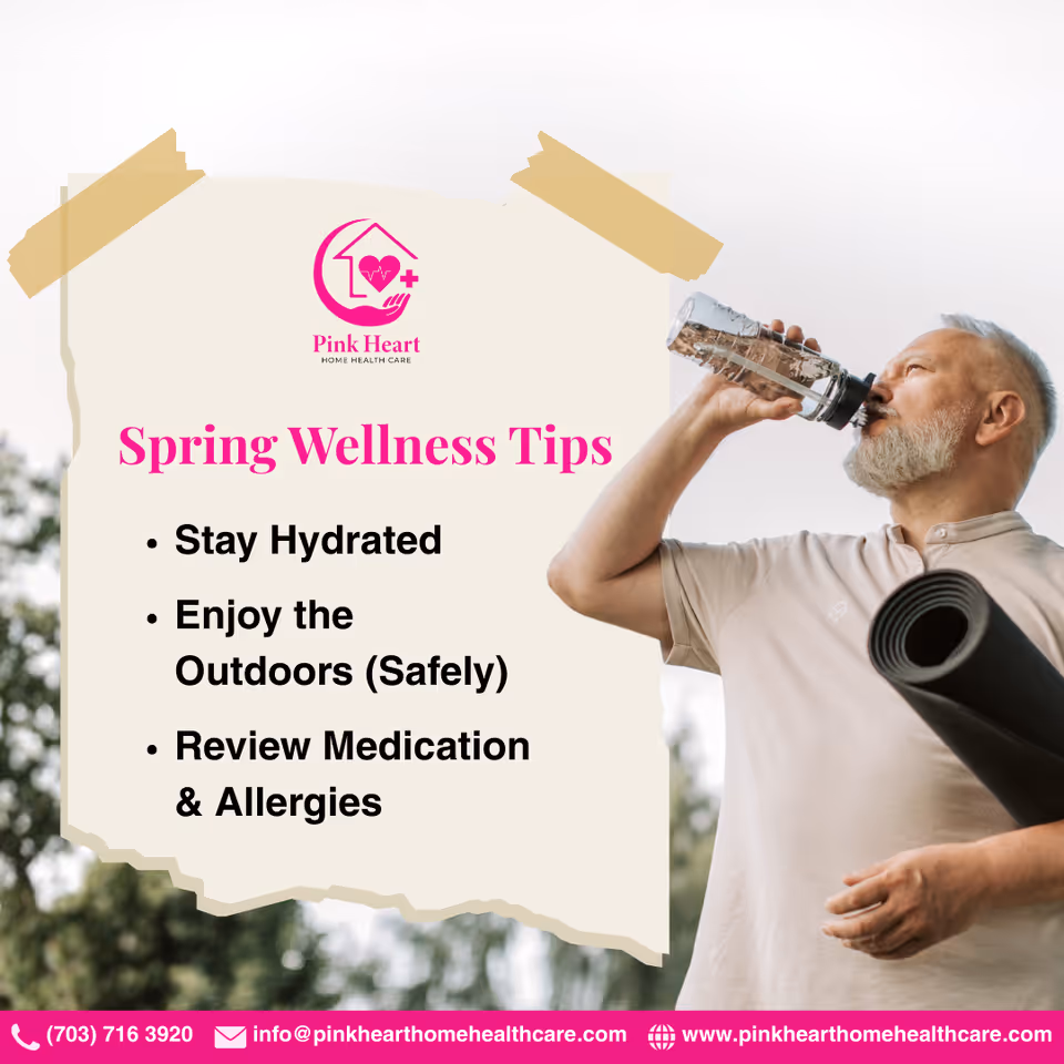 A senior man drinks water beside a Pink Heart Home Health Care wellness sign.