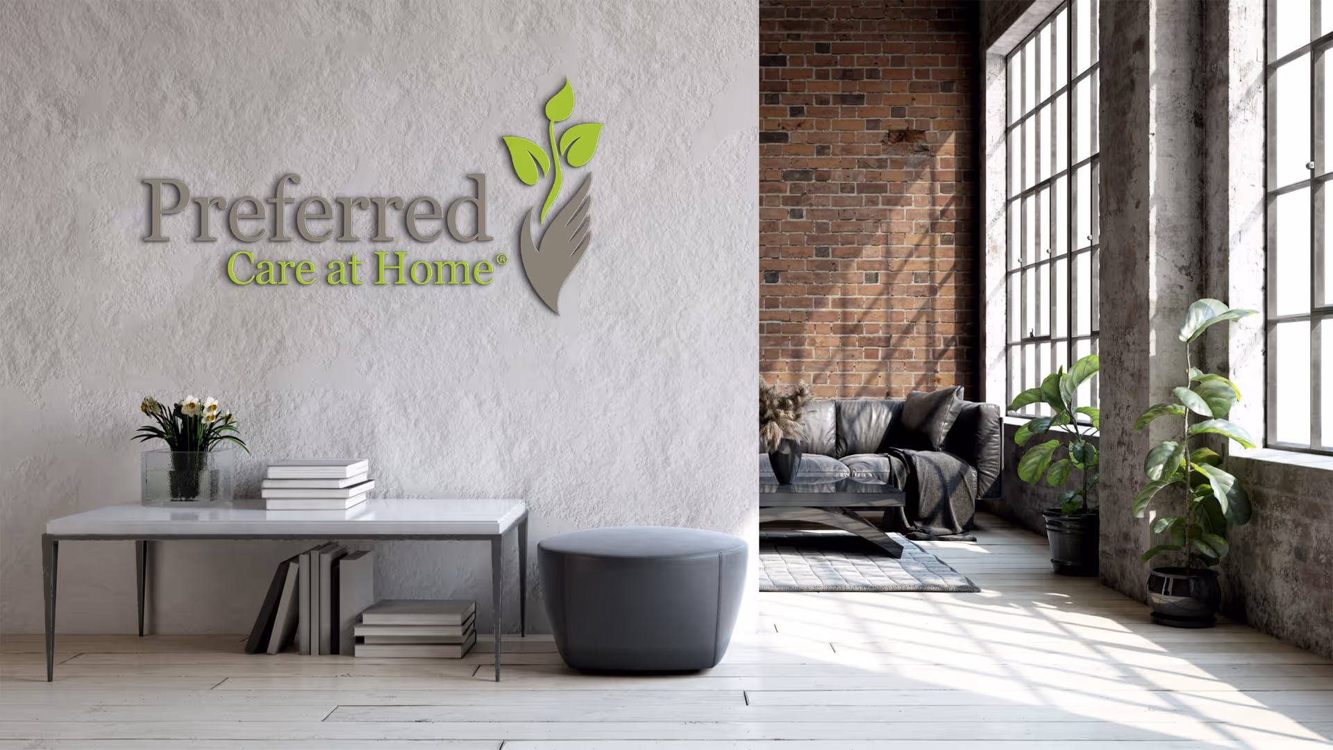 Lobby area with Preferred Care at Home logo, modern seating, plants, and brick wall.
