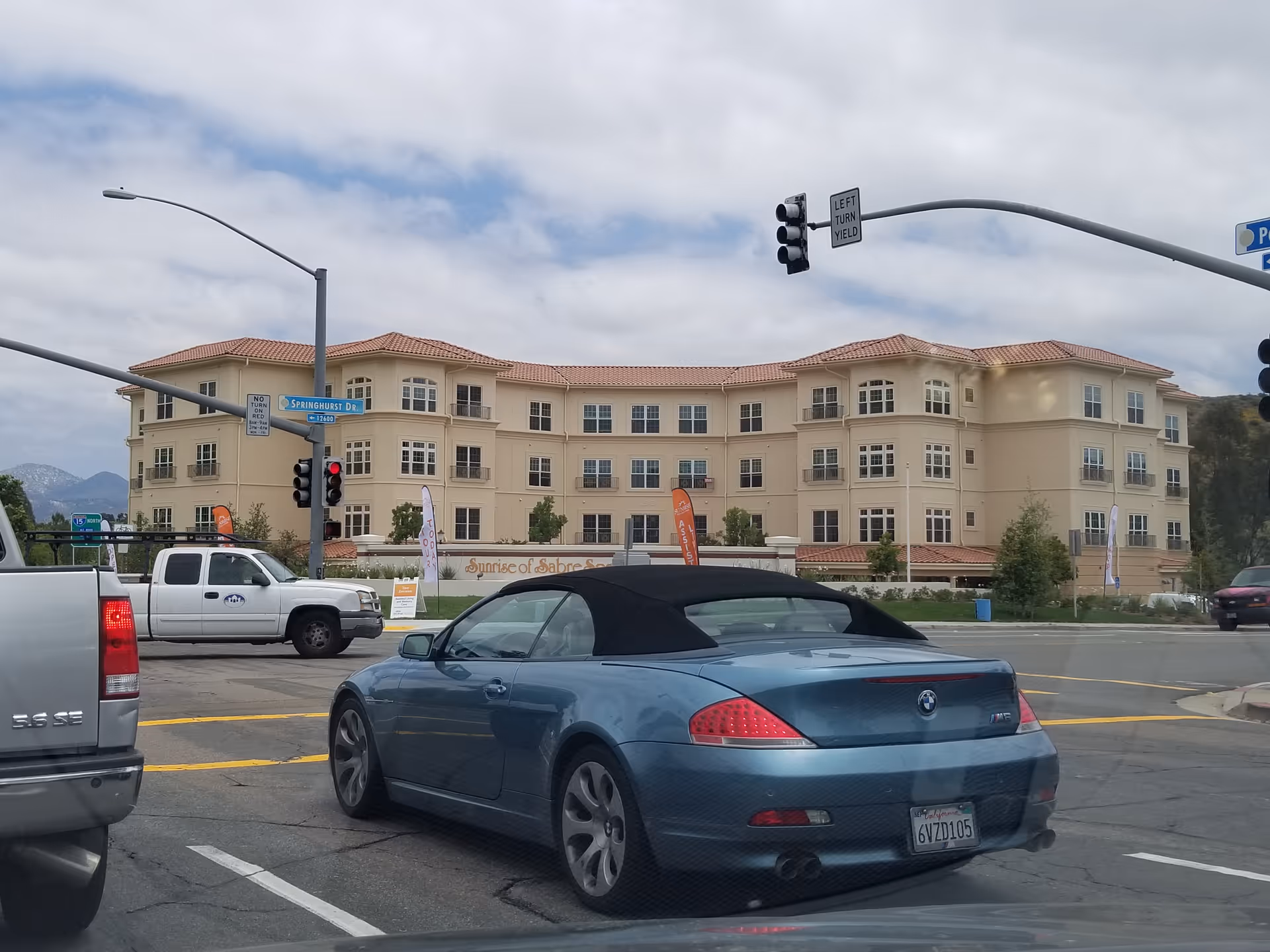 Wide street view of Ivy Park at Sabre Springs exterior building with cars