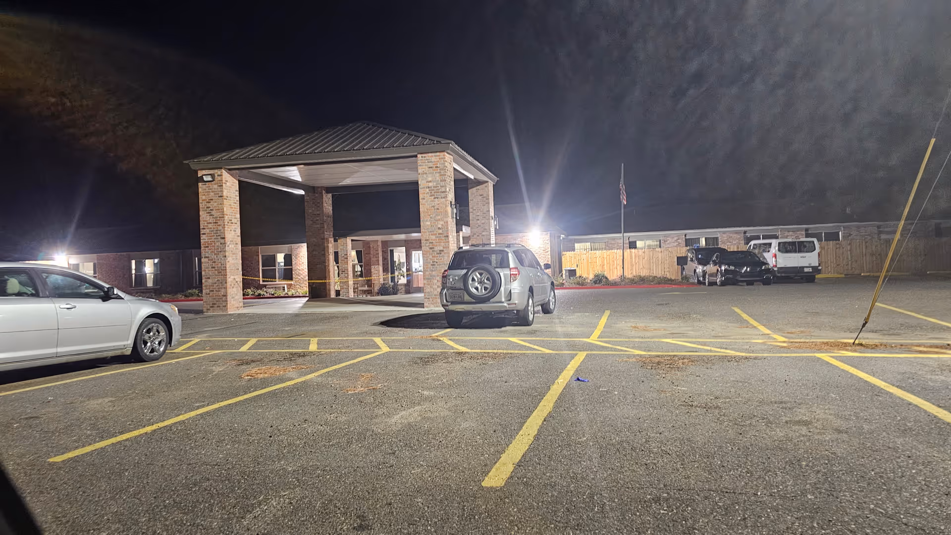 Night view of St Christina Nursing and Rehabilitation Center entrance with a brick porte-cochere.