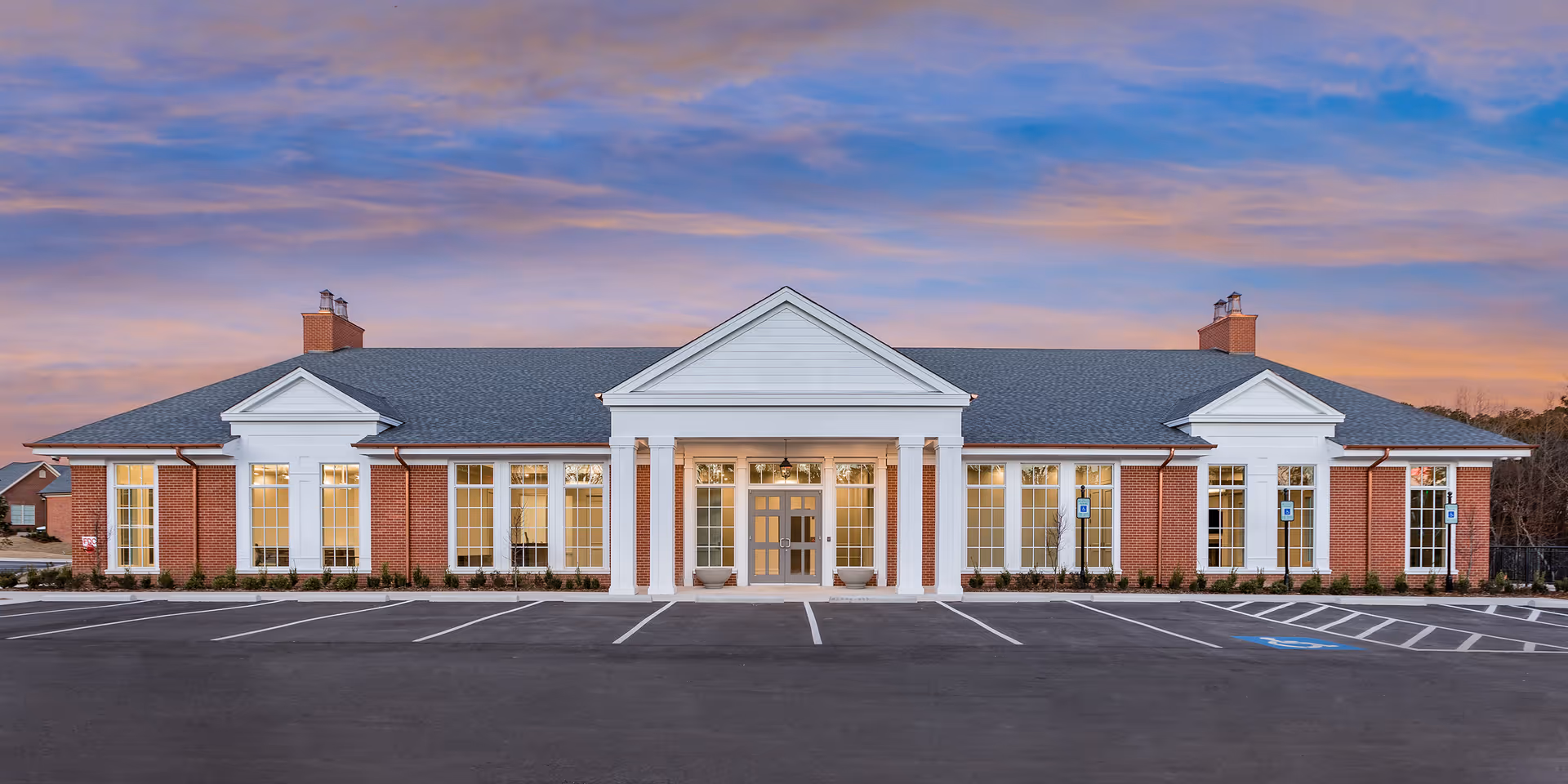 Chenal Village senior living facility with brick front and parking lot.
