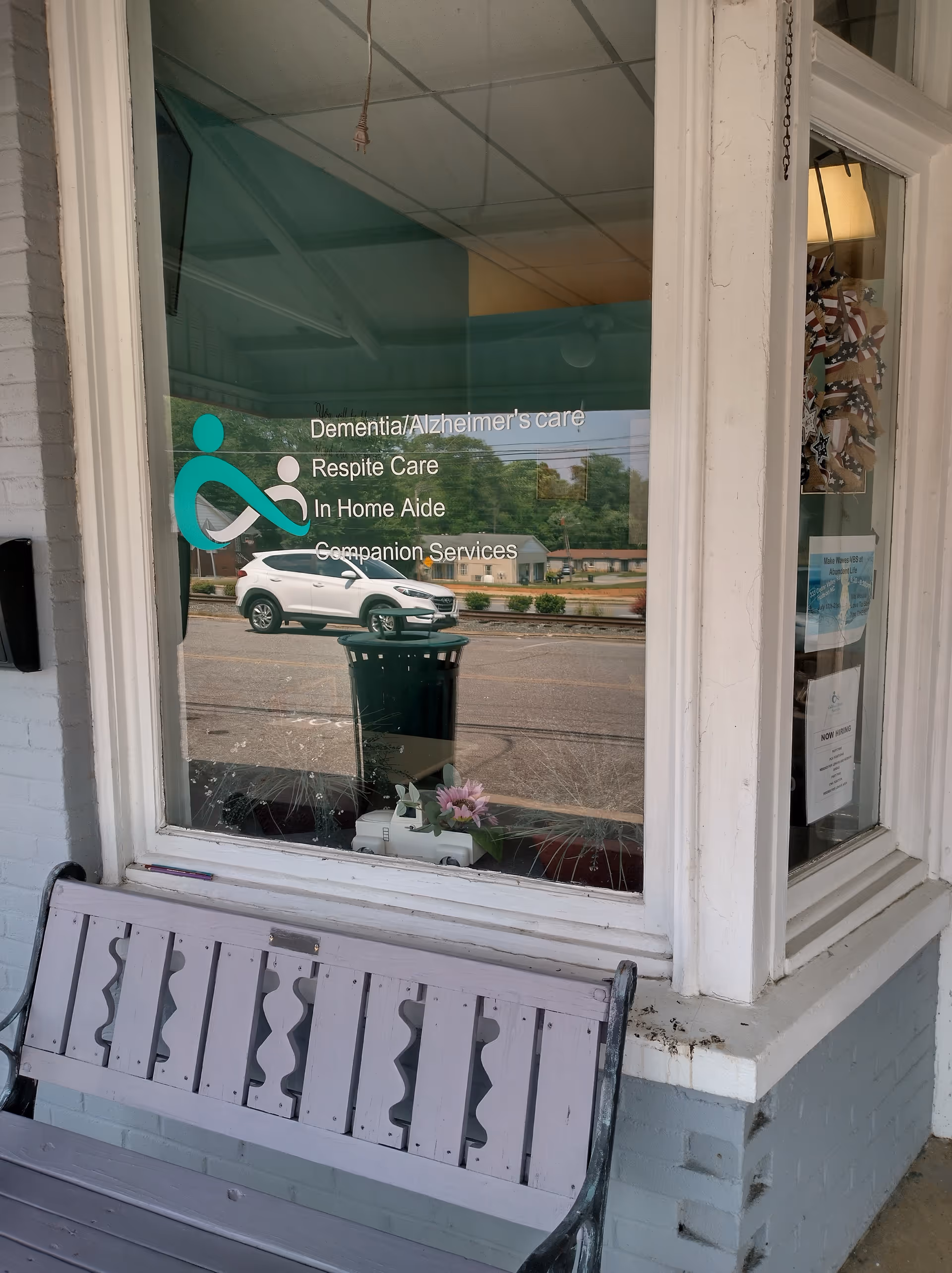 Front window of Caldwell Home Services lists dementia care and in home services.