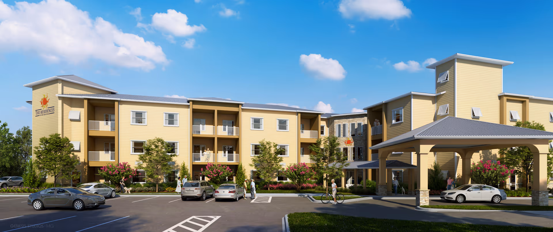 Exterior view of The Residences at Zon Beachside, a three-story yellow building with balconies, surrounded by trees and landscaping. Several cars are parked in the parking lot in front of the building, and a few people are walking or standing near the entrance and parking area under a covered drop-off.