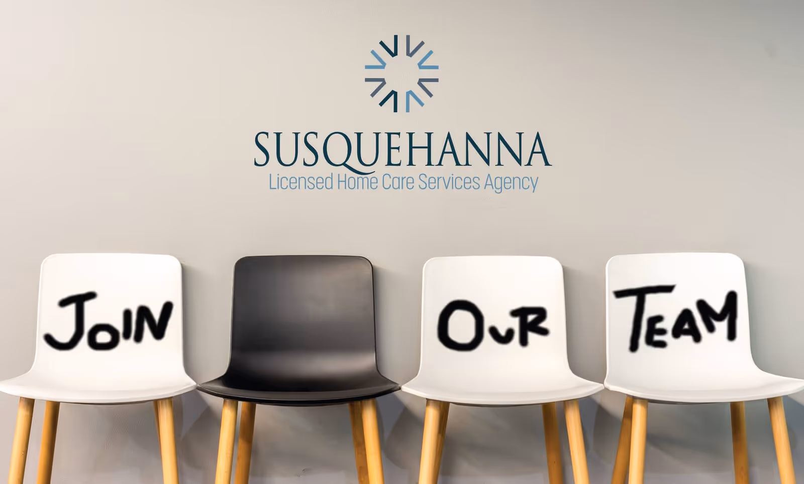 Interior lobby showing Susquehanna logo and four chairs with 'Join Our Team' messaging.
