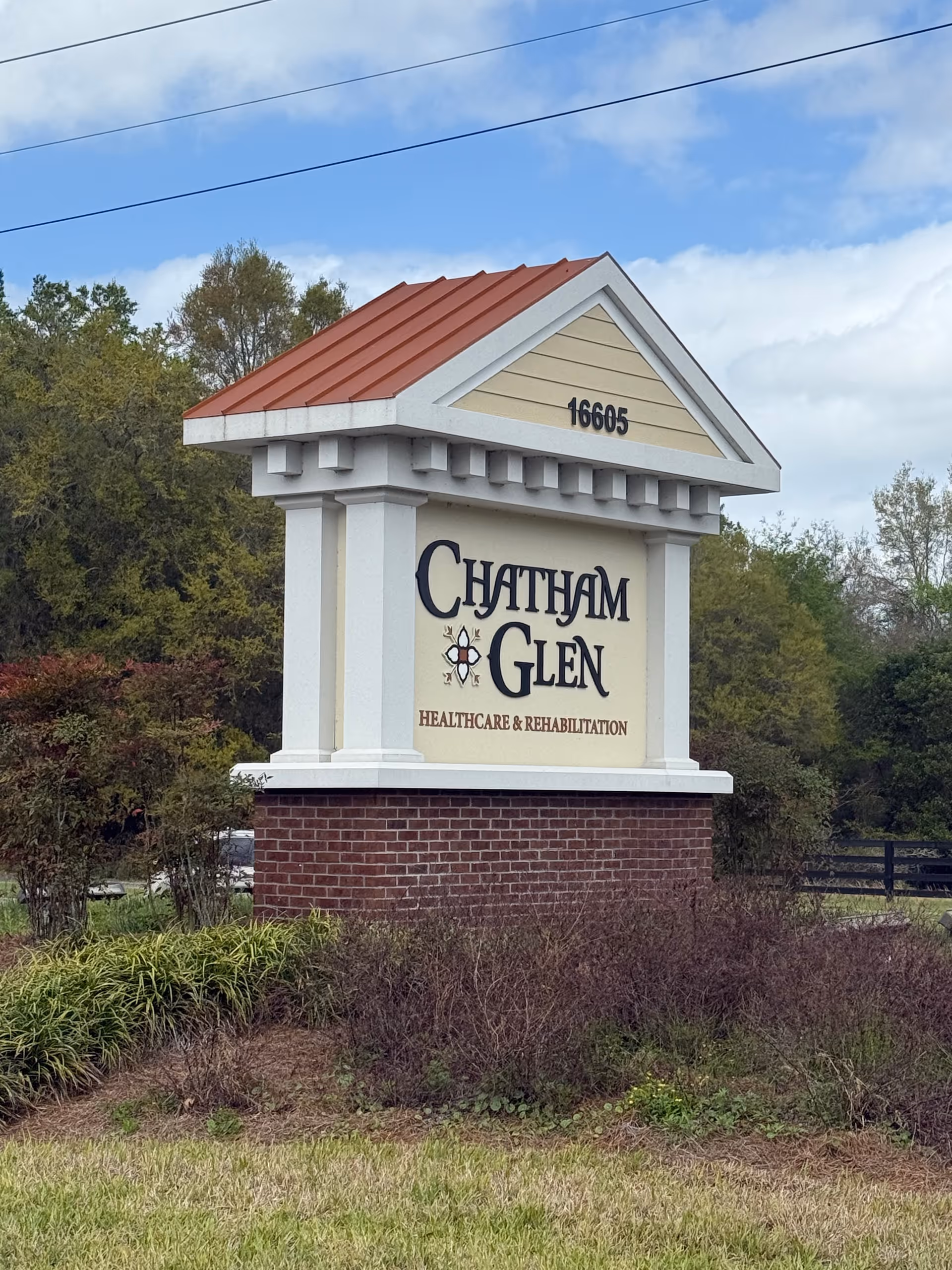 Exterior sign reading Chatham Glen Healthcare & Rehabilitation on a brick pedestal