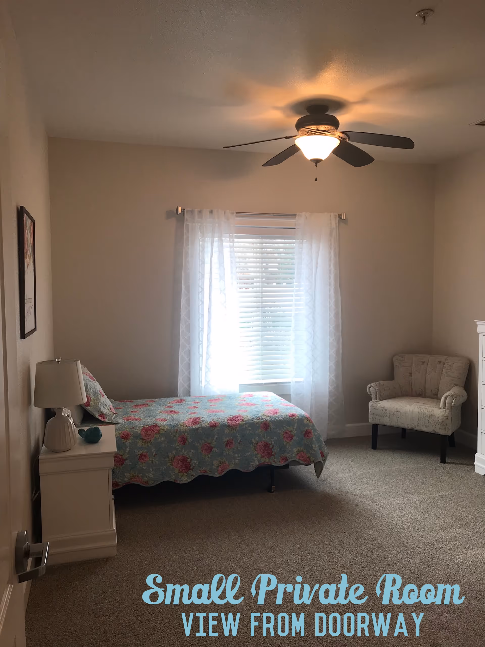 Small Private Bedroom with bed, nightstand, lamp, window, ceiling fan, and an upholstered chair.