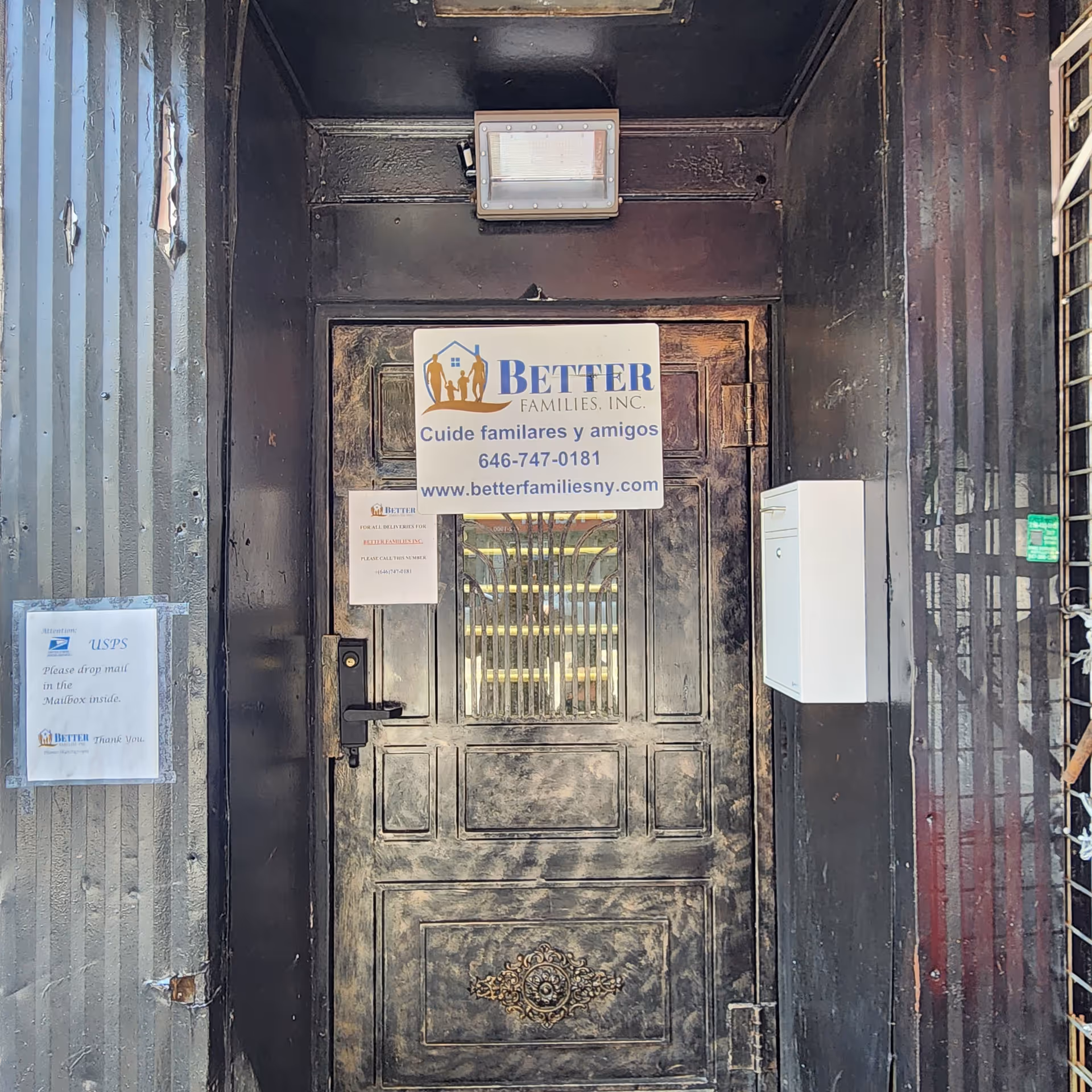 Front entrance door with Better Families, Inc. sign and mail slot.