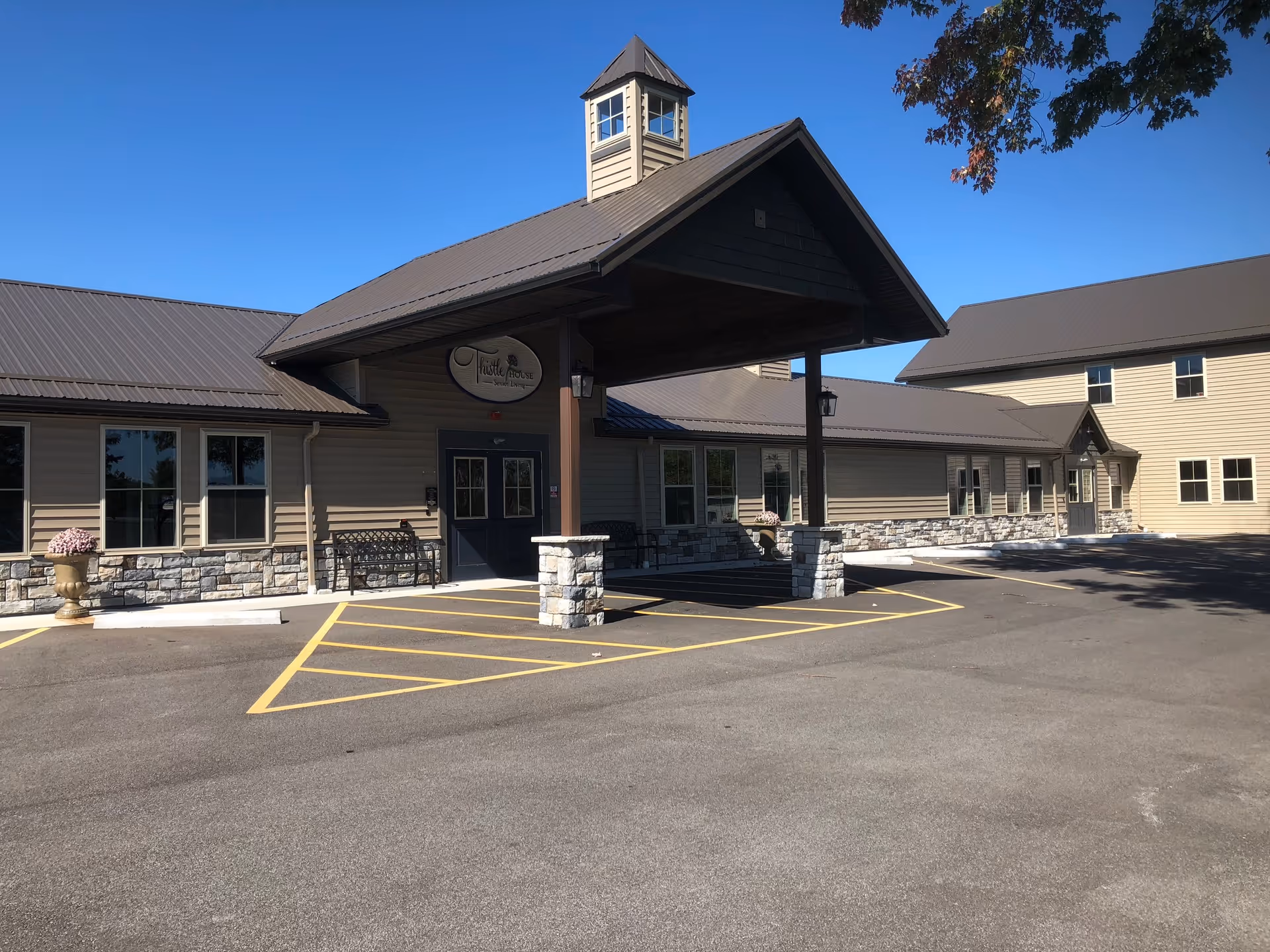 Exterior view of FirstLight Home Care of Chardon building with entrance and parking area.
