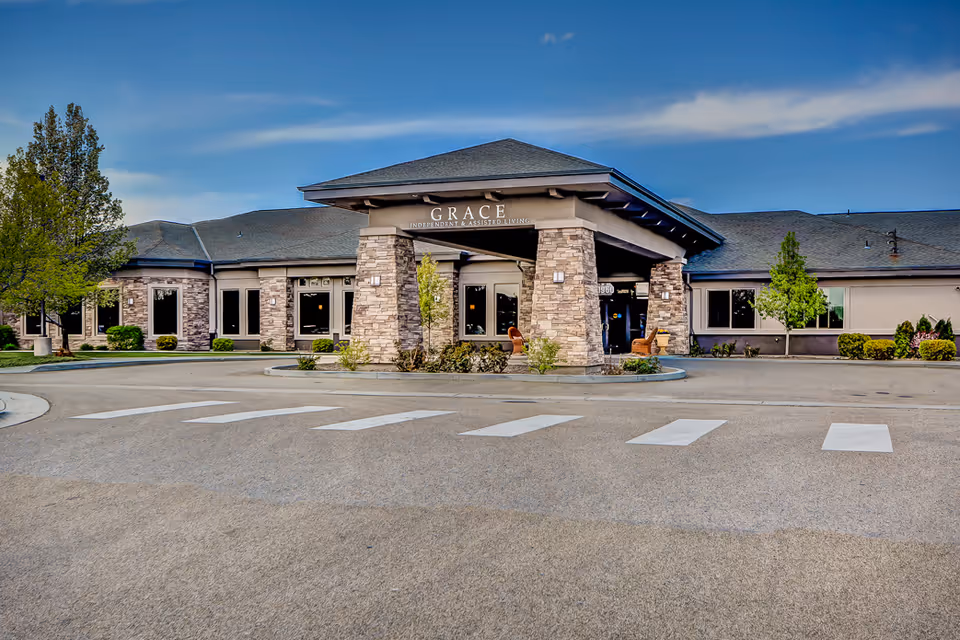 Front view of Grace Assisted Living facility with stone columns and entrance canopy.