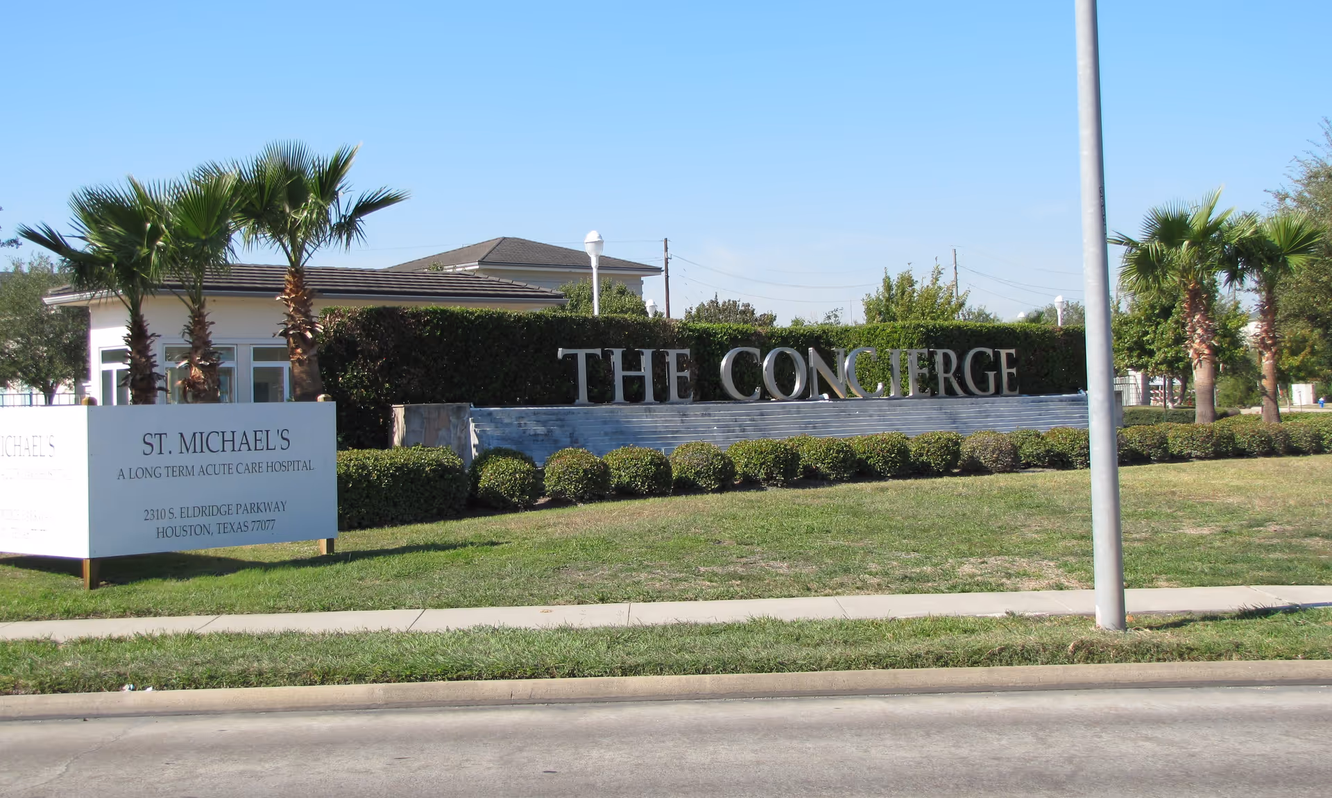 Exterior view of a senior living facility with a large 'THE CONCIERGE' sign.