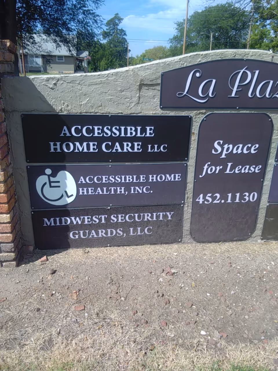 Exterior sign wall displays Accessible Home Care LLC and related service signs at the entrance.