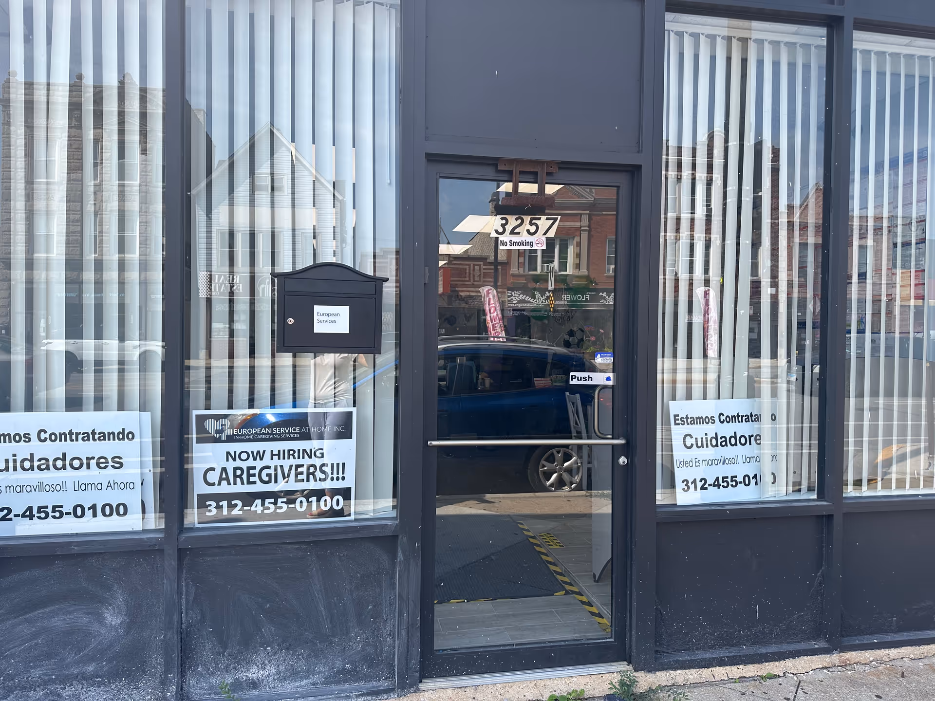 Storefront for European Service at Home, Inc., with caregiver hiring signs in windows.