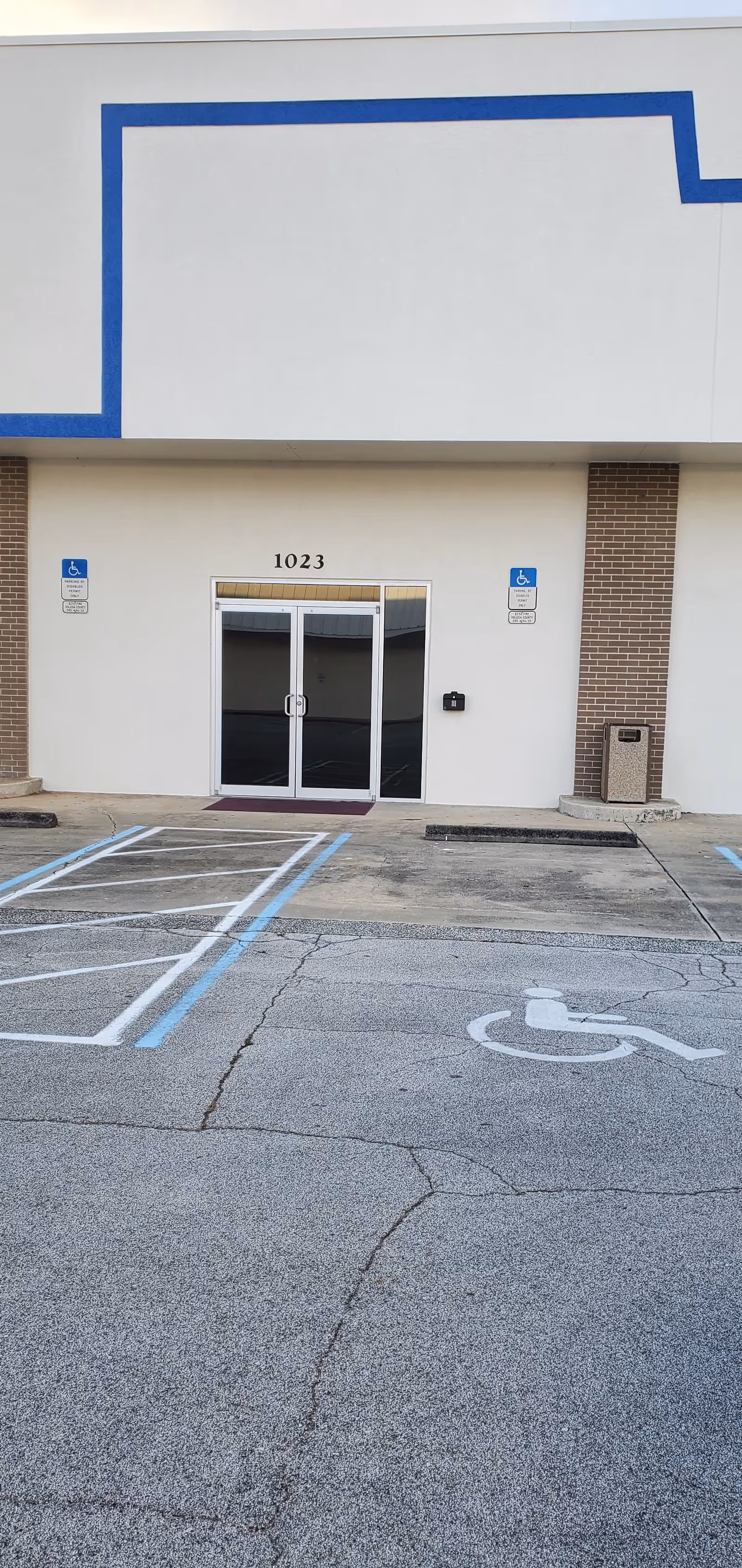 Front entrance of Denein Senior Services with accessible parking in front.