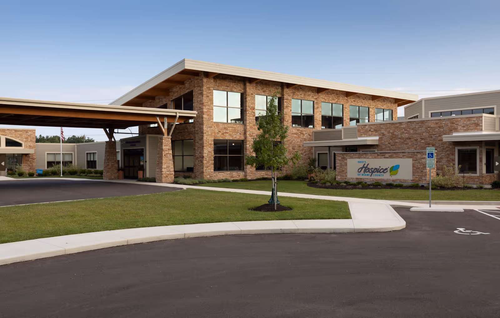 Exterior view of Ohio's Hospice of Miami County facility with brick front and entrance.