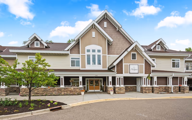 Exterior view of Encore Assisted Living and Memory Care at Maplewood with a multi-gabled building.