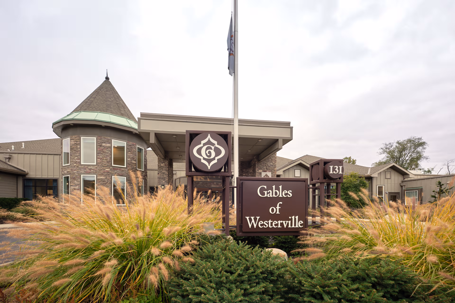 Front exterior of The Gables of Westerville with signage and landscaped entrance.