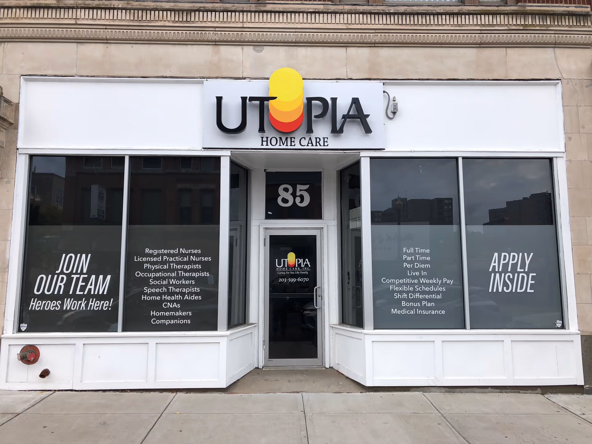 Storefront of Utopia Home Care with large windows and entry door.