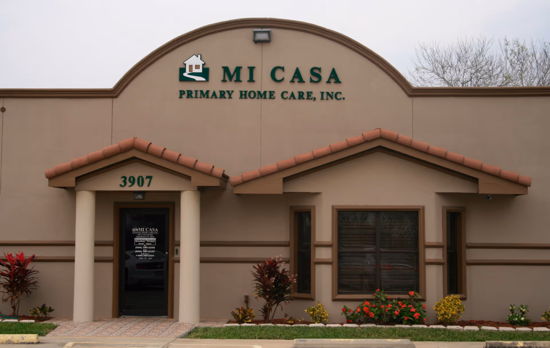 Front view of MI Casa Primary Home Care, Inc. building with entrance and landscaping.