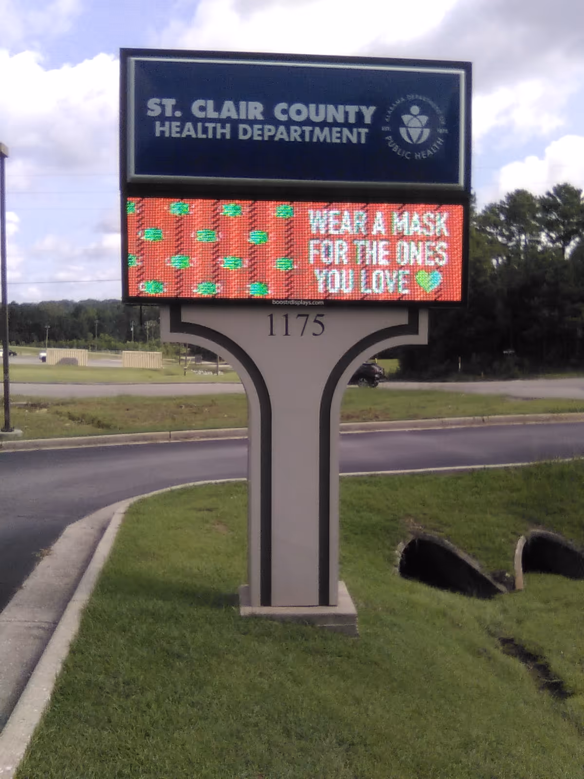 Outdoor sign for St. Clair County Health Department displays mask-wearing message.