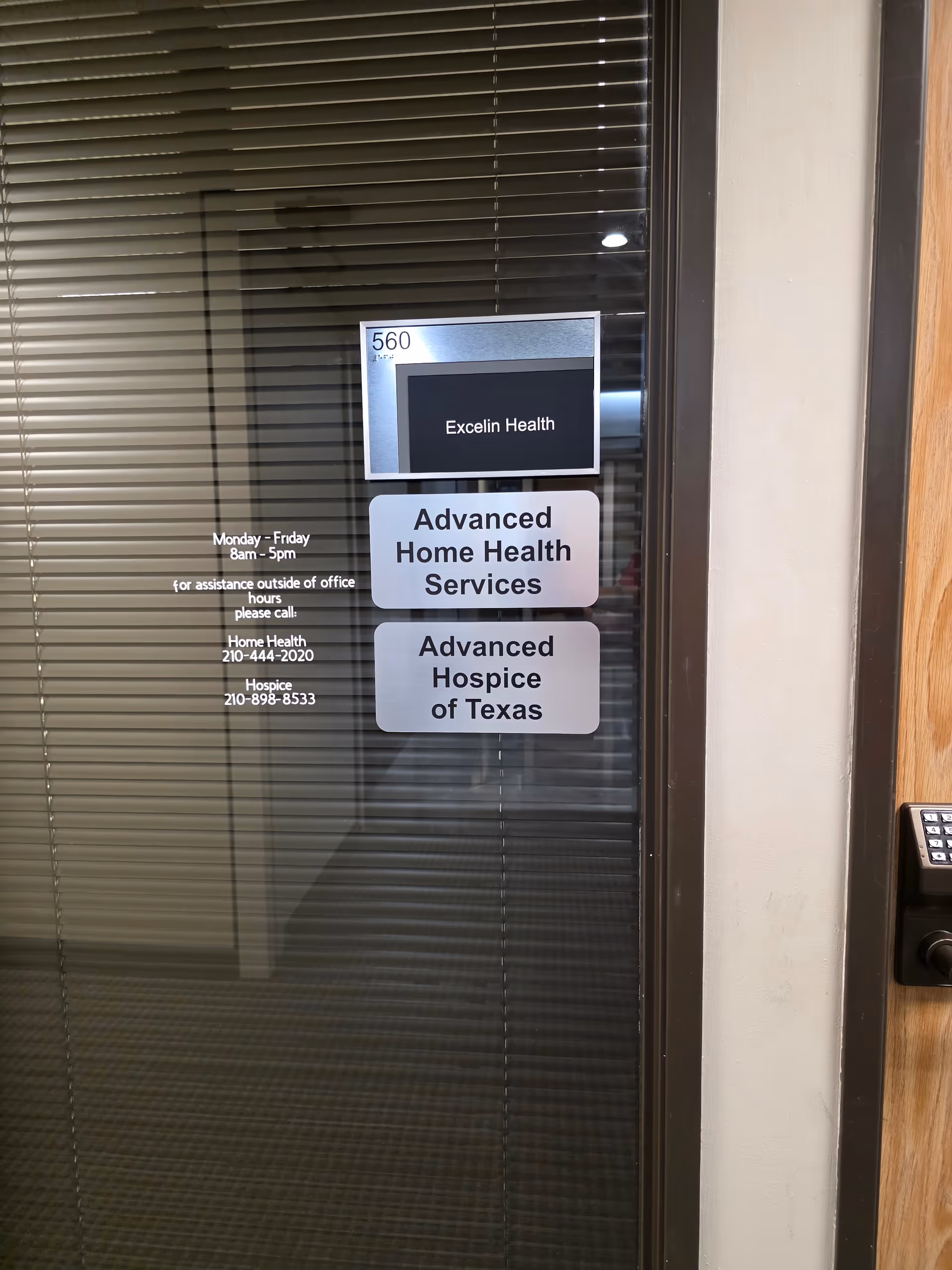 Glass door with signs for Advanced Home Health Services and Advanced Hospice of Texas