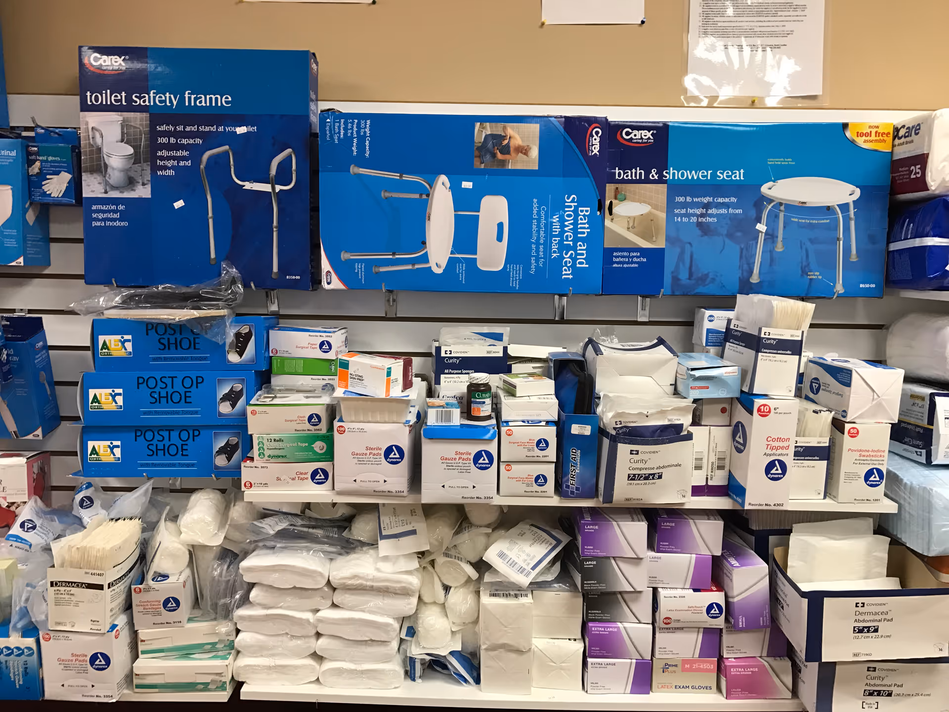 Shelves filled with boxed medical supplies and bath safety equipment.