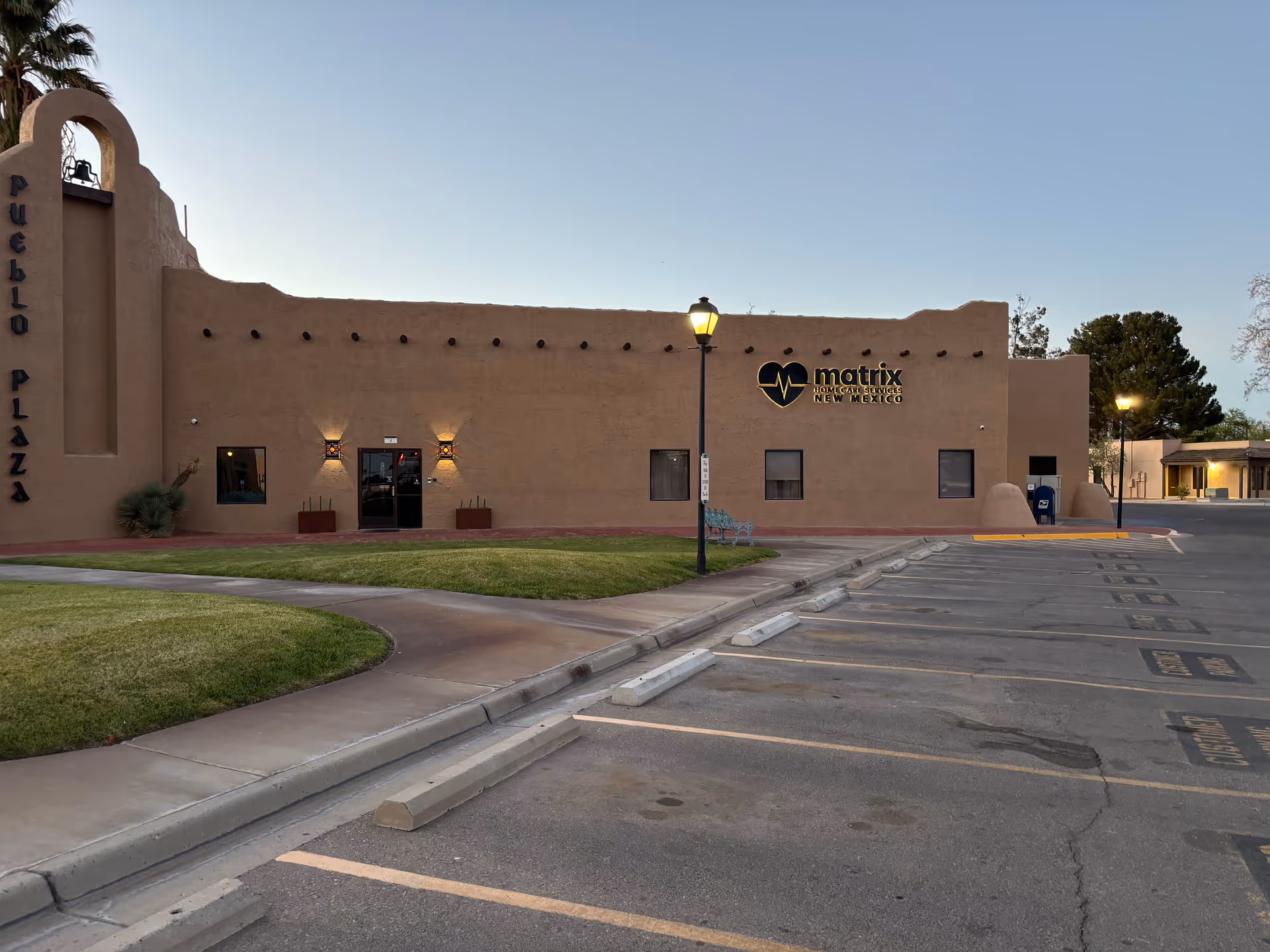 Exterior view of Matrix Home Care Services of New Mexico building with parking.