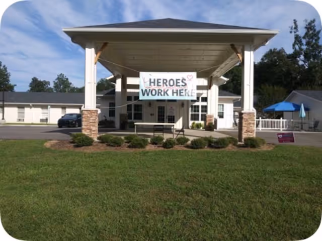 Front view of Meadowview Nursing Center entrance with a covered porte-cochere.