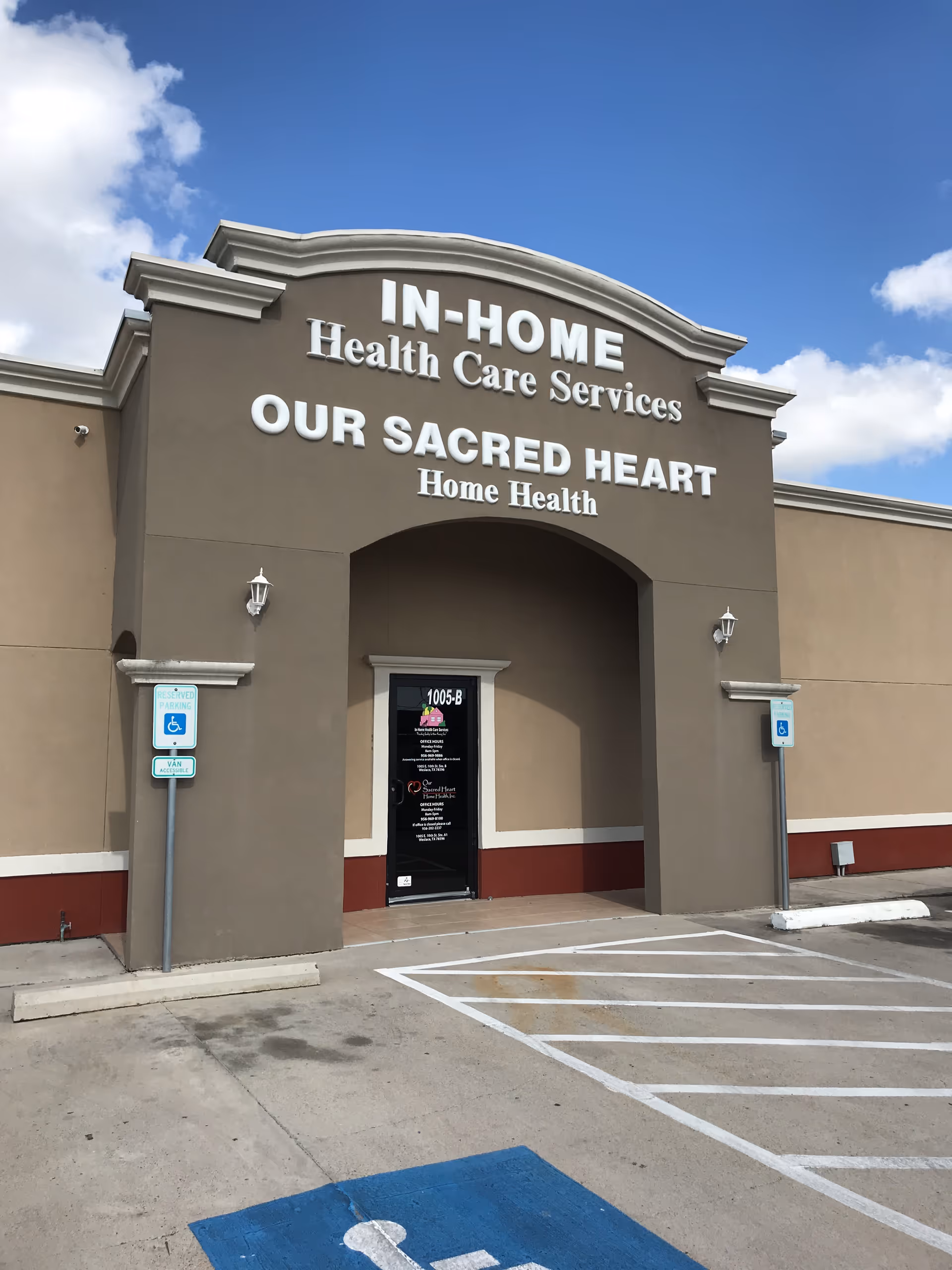 Front view of a beige building with the 'OUR SACRED HEART Home Health' sign.