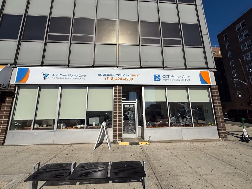 Facade of a modern building with large windows and C&T Home Care signage.