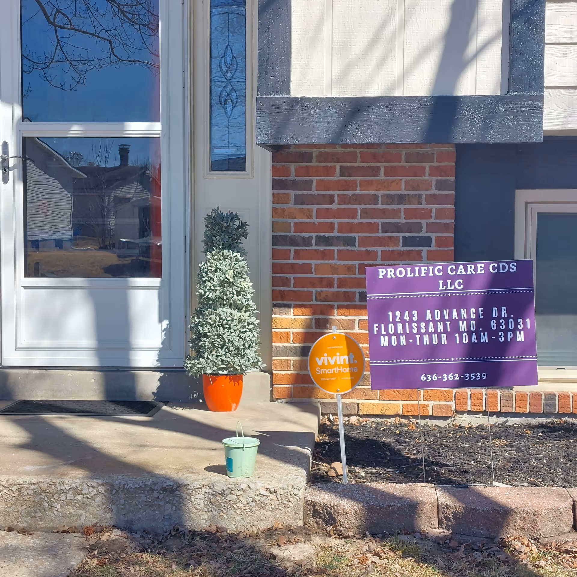 Exterior view of Prolific Care CDS LLC entrance with purple sign.