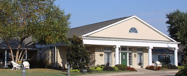 Exterior of a single-story assisted living facility with a front porch.