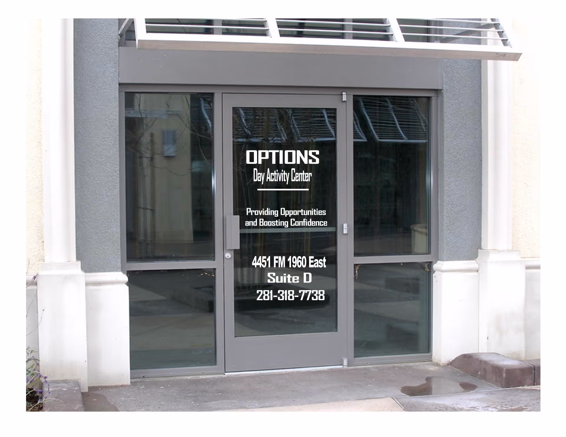 Glass door entrance with OPTIONS Day Activity Center signage on a beige building facade.