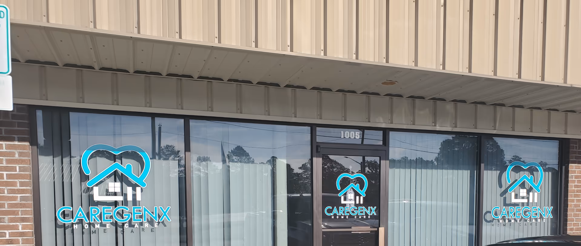 Exterior storefront of Caregenx Home Care with turquoise logos on glass windows.
