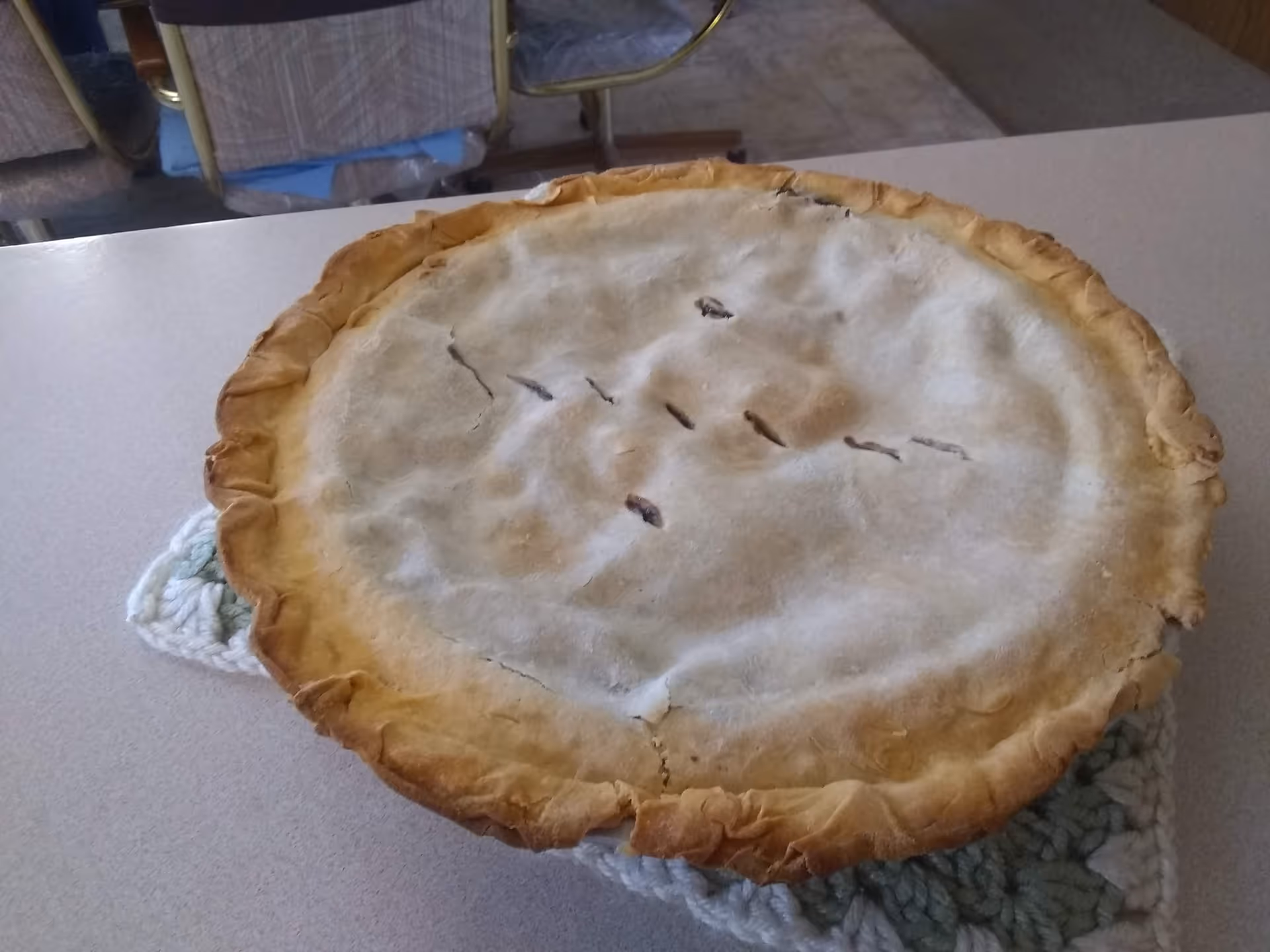 Large pie cooling on a dining room table at Heritage Harbor.