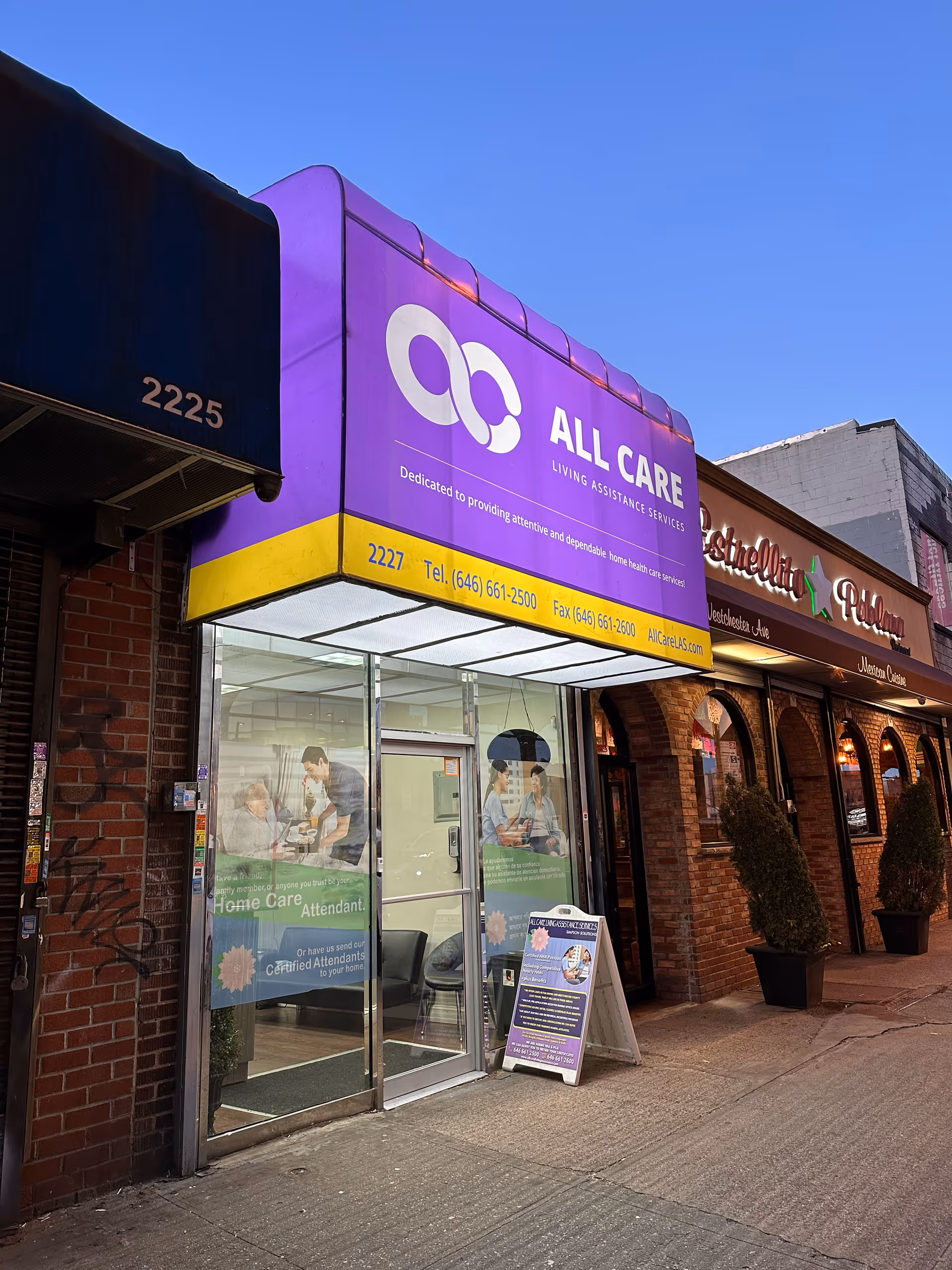 Purple All Care storefront signage on a city street front.