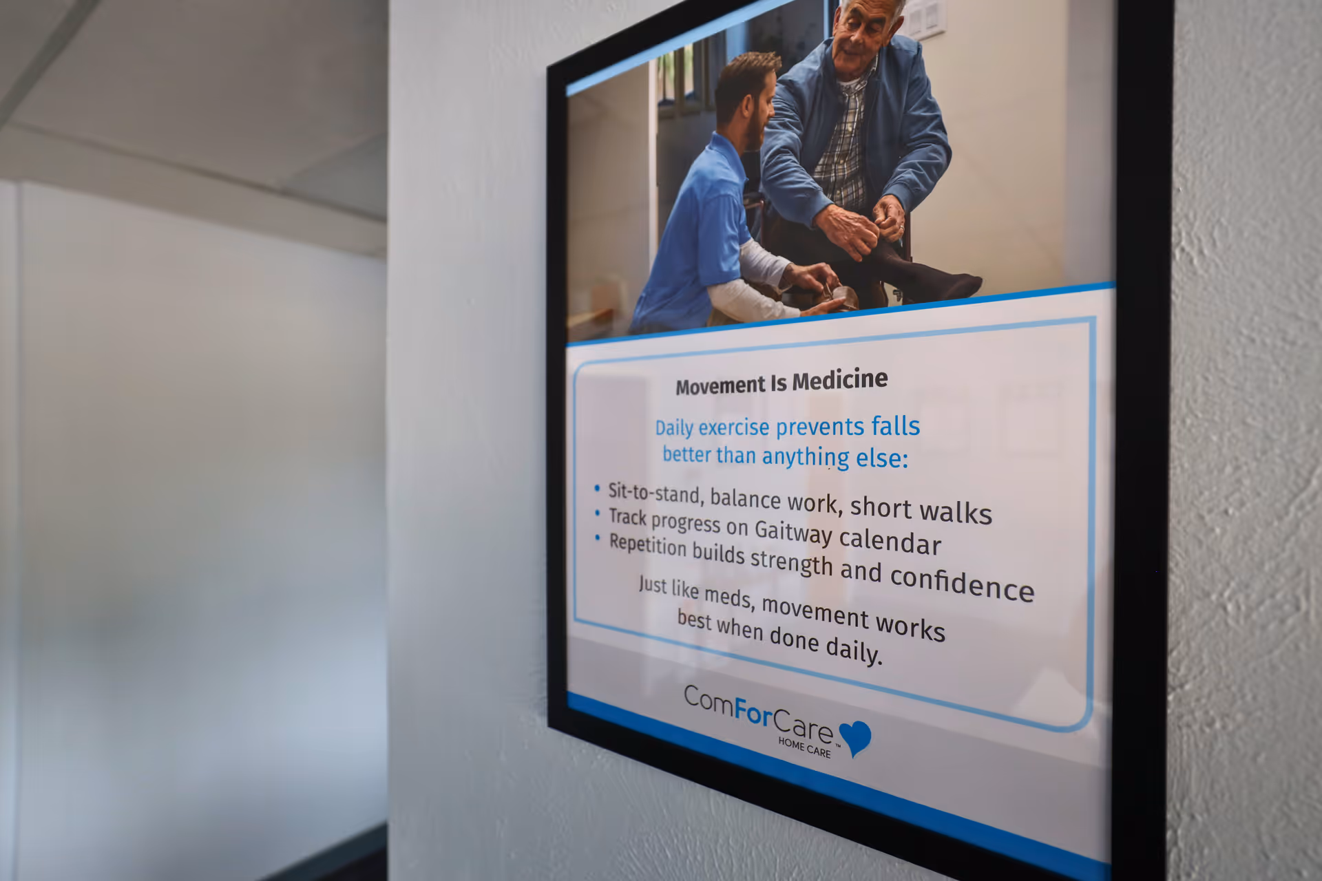 Interior hallway with a framed poster about Movement Is Medicine for ComForCare Home Care.
