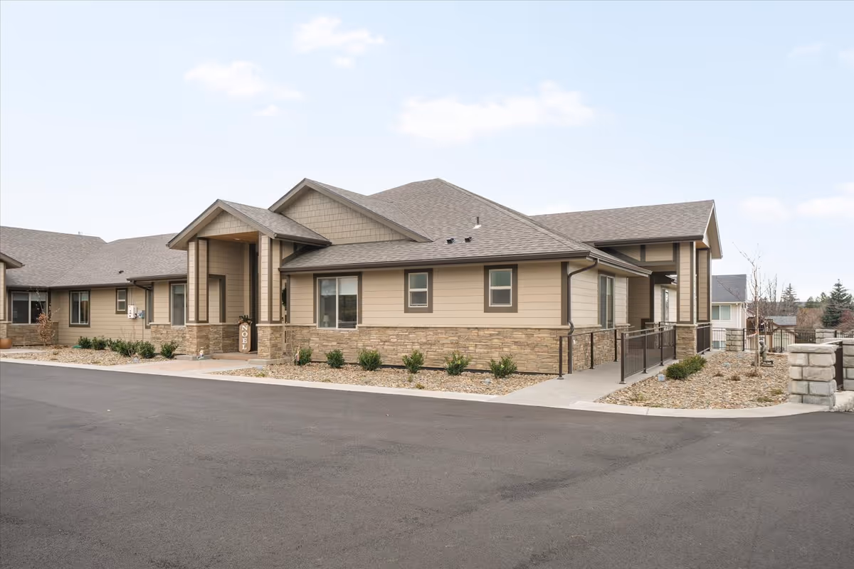 Exterior view of Providence Senior Home, LLC building with entryway and wheelchair ramp