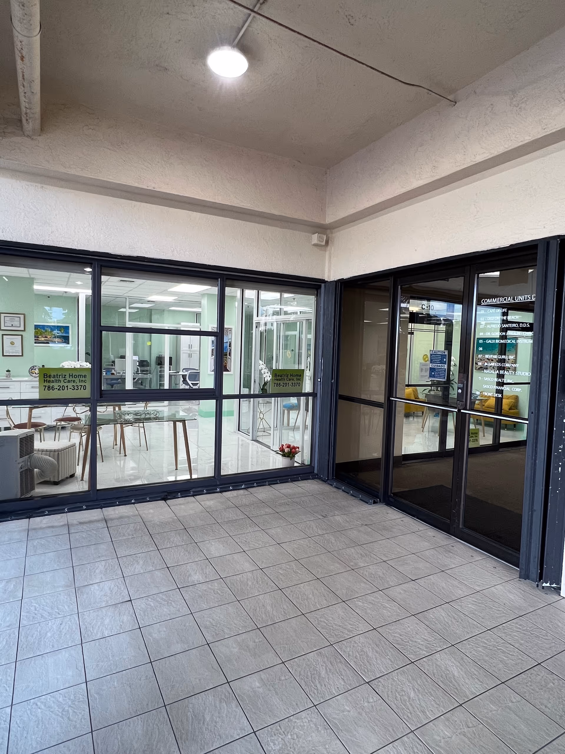 Exterior glass entrance to Beatriz Home Health Care, Inc. with lobby visible inside.
