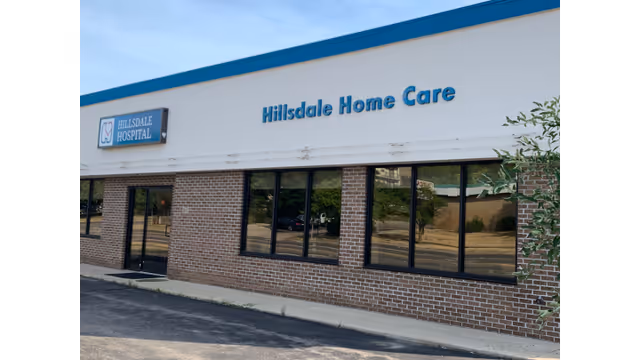 Exterior view of Hillsdale Home Care storefront with brick facade and large windows.