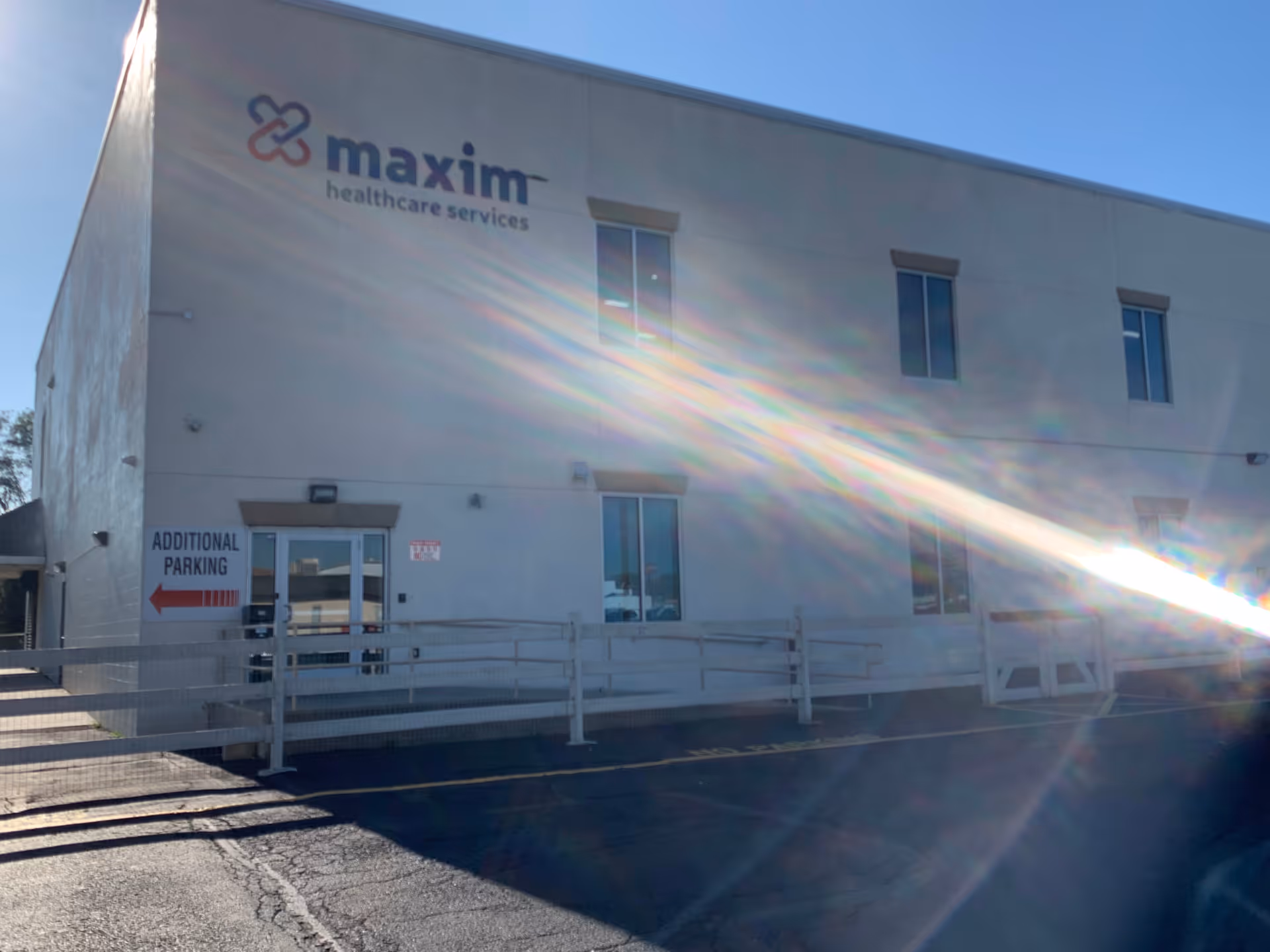 Exterior view of Maxim Healthcare Northeast Philadelphia office with a large sign