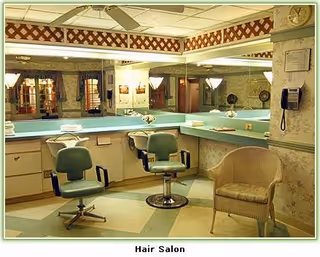 Vintage-style senior living hair salon with mirrors, teal countertops, and multiple styling chairs.