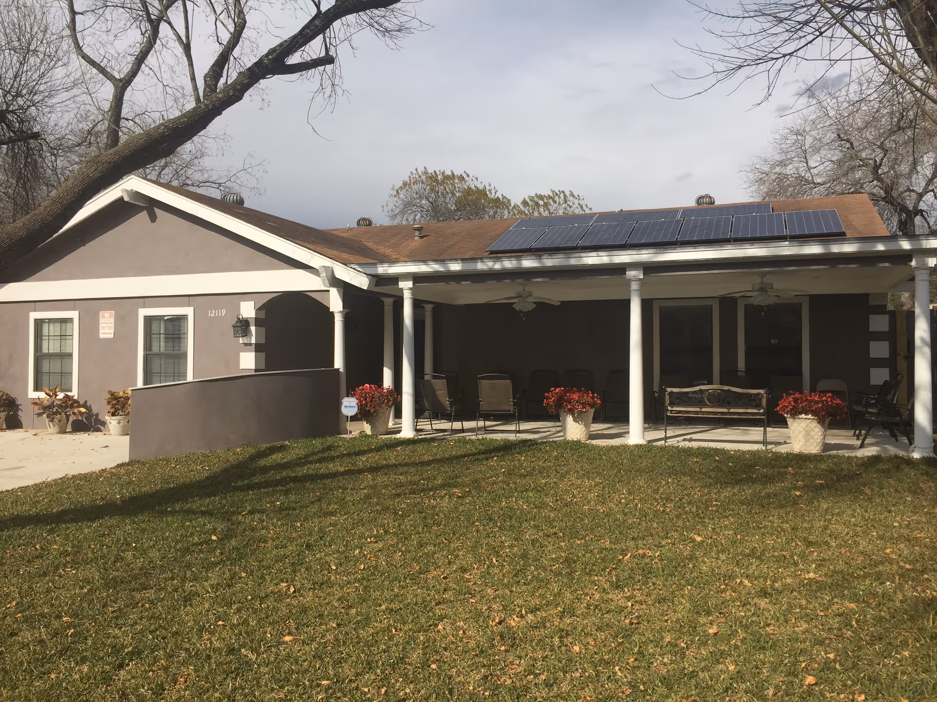 Front view of Heart to Heart Assisted Living with a covered porch and seating.