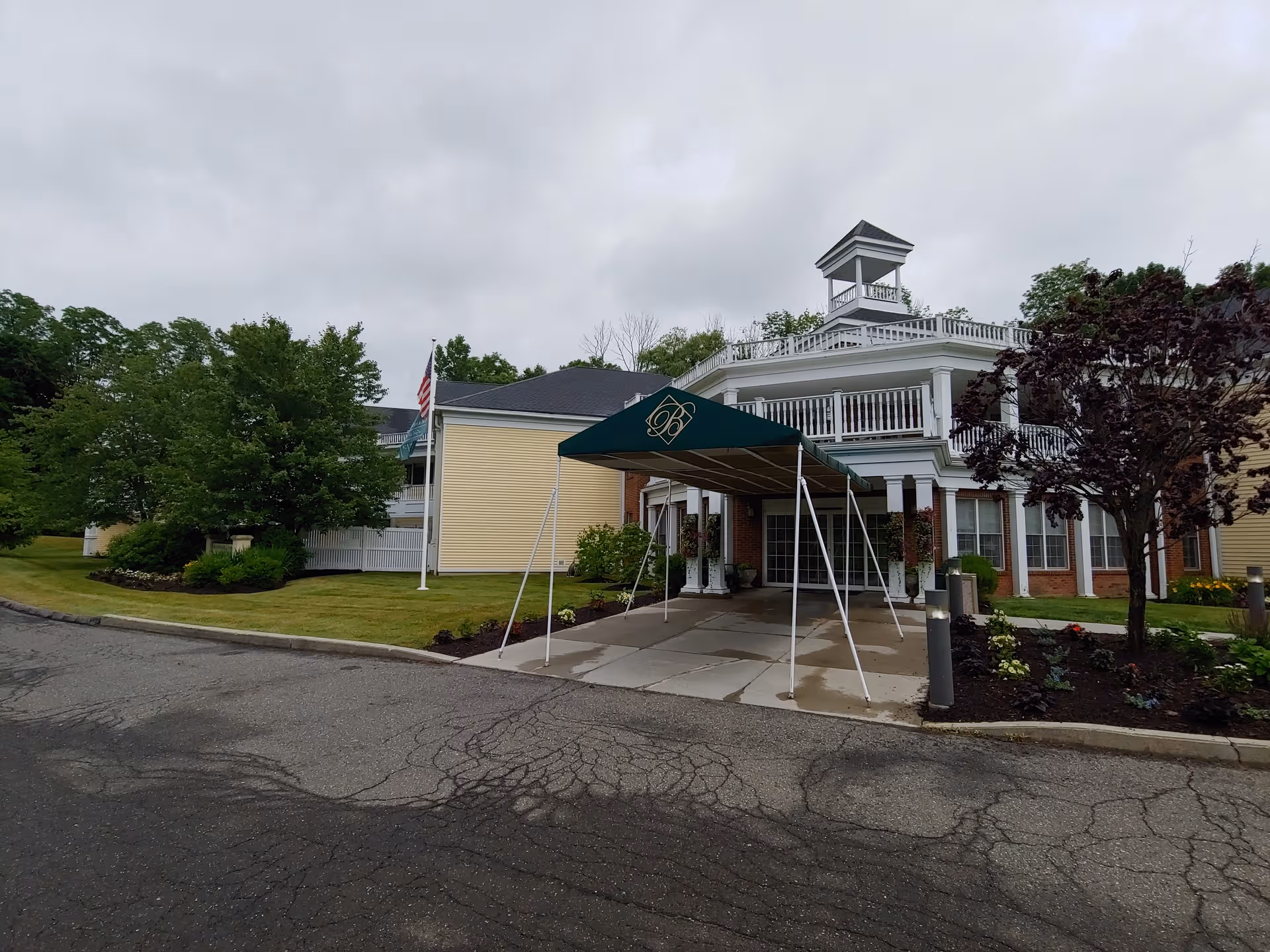 Exterior view of Brandywine Litchfield by Monarch entrance with a green canopy.