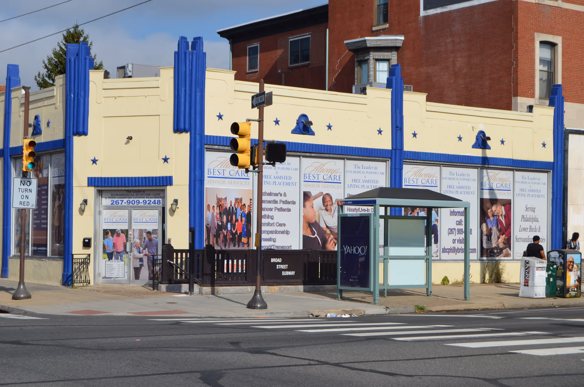 Facade of Always Best Care Senior Services storefront with blue decorative columns on a city street.