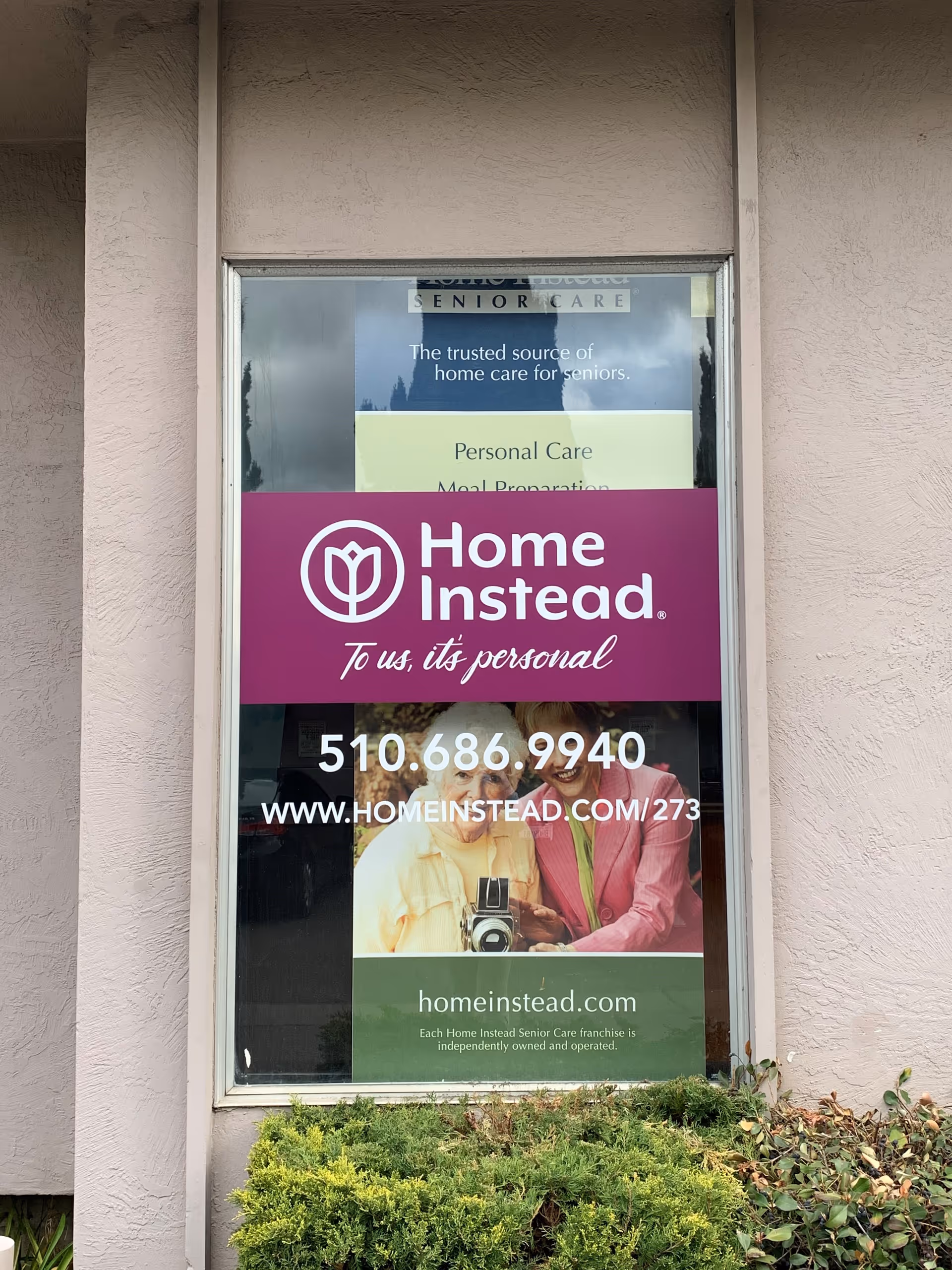 Exterior window displays Home Instead Senior Care signage and Castro Valley contact information.